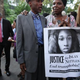People gather with then-New York City mayoral candidate Bill de Blasio (back, left) before a vigil Aug. 27, 2013, for Islan Nettles, a transgender woman who was slain in Harlem after being approached on the street and beaten by a group of men.
Mario Tama/Getty Images